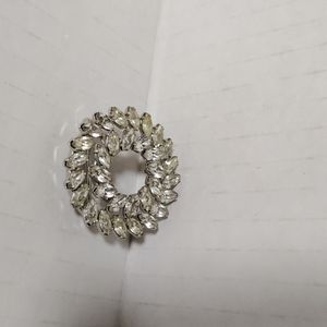 Silver tone vintage brooch pin with white rhinestone